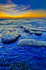 Indonesia. Sunset light can be absorbed and reflected by the black sand. Art Print